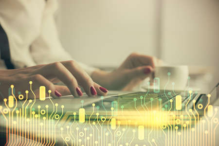 Multi exposure of woman hands working on computer and data theme hologram drawing. Tech concept.