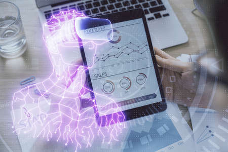 Double exposure of man's hands holding and using a digital device and AR glasses drawing. Virtual...