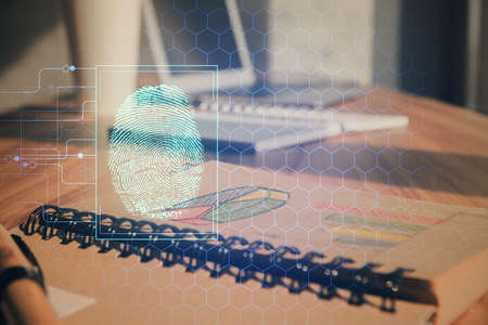Double exposure of finger print drawing and desk with open notebook background. Concept of security