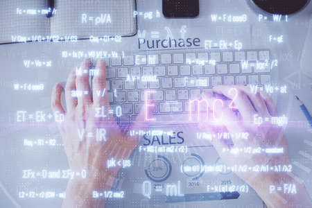 Double exposure of man's hands typing over computer keyboard and formula hologram drawing. Top view....