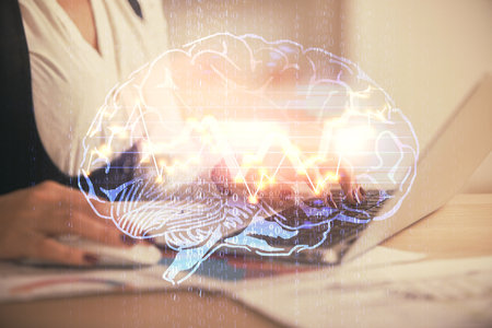 Multi exposure of woman hands working on computer and human brain hologram drawing. Ai tech concept.の写真素材