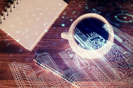 Double exposure of city drawing and work table top veiw. Concept of tech in live.