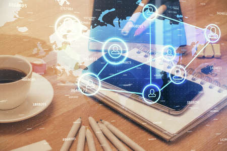 Double exposure of social network theme drawing and cell phone background. Concept of people...