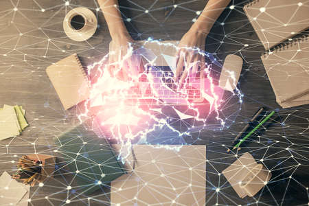 Double exposure of woman working on computer andhuman brain hologram drawing. Top View. Ai concept.