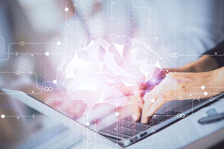 Double exposure of woman hands working on computer and brain hologram drawing. Ai concept.