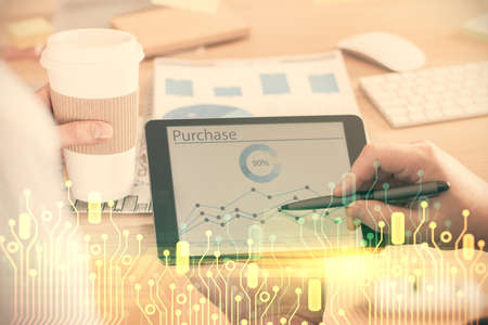 Multi exposure of man's hands holding and using a digital device and data theme drawing. Innovation concept.の写真素材