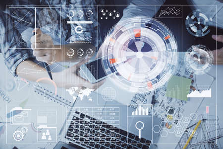 Double exposure of data theme hologram drawing and man and woman working together holding and using...
