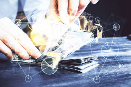 Multi exposure of brain drawing hologram and us dollars bills and man hands. Ai invest conceptの写真素材