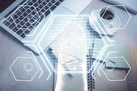 Finger print over computer on the desktop tableの写真素材