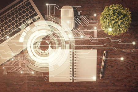 Double exposure of data theme drawing hologram over topview work tableの写真素材