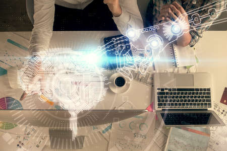 Double exposure of man and woman working together and human brain hologram drawing.
