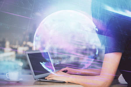 Double exposure of woman hands typing on computer and technology theme drawing. High Tech concept.の写真素材