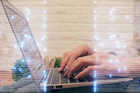 Double exposure of woman hands typing on computer and technology theme drawing. High Tech concept.