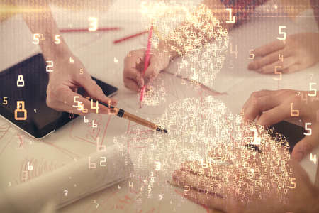 Double exposure of tech theme hologram and man and woman working together holding and using a mobile device.の写真素材