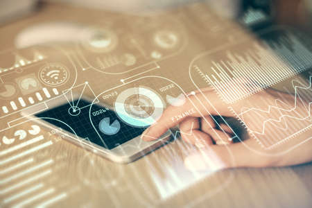 Double exposure of tech icon hologram and woman holding and using a mobile device. Technology...