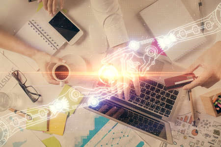 Double exposure of man's hands typing over computer keyboard and data theme hologram drawing. Top view. Technology concept.の写真素材