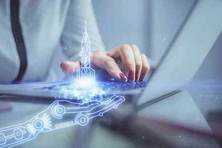Double exposure of woman hands typing on computer and creative drawing. Start up concept.