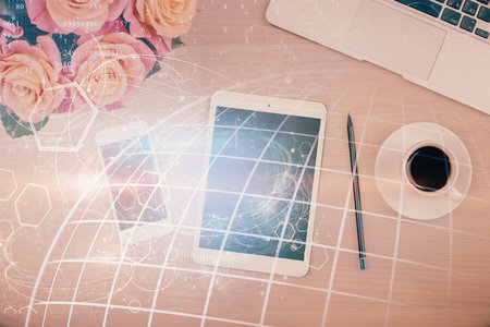 Double exposure of map hologram drawing over desktop. Top view. International connection concept.の写真素材