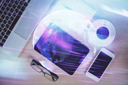 Multi exposure of technology theme drawing over table with phone. Top view. Concept of hightech.の写真素材