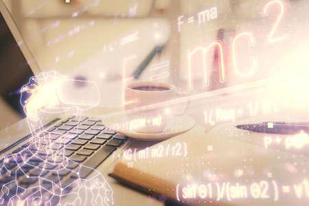 Double exposure of formula drawing and desktop with coffee and items on table background. Concept of...