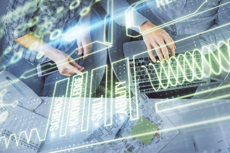 Double exposure of man and woman working together and education theme hologram drawing. Computer...
