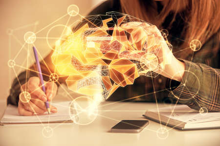 Double exposure of woman on-line shopping holding a credit card and brain hologram drawing. Data...