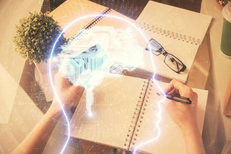 Double exposure of woman on-line shopping holding a credit card and brain hologram drawing. Data...