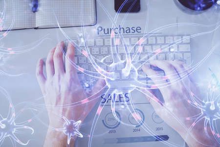 Double exposure of man's hands typing over computer keyboard and neuron hologram drawing. Top view....
