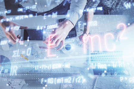 Double exposure of man and woman working together and formula hologram drawing. Computer background....