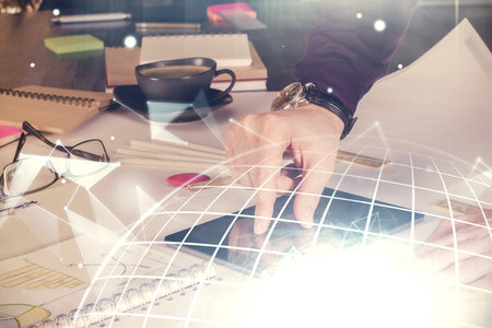 Multi exposure of man's hands holding and using a digital device and map drawing. International business concept.の写真素材