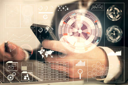 Multi exposure of man's hand holding and using a digital device and data theme drawing. Innovation...