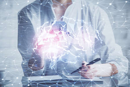Double exposure of brain sketch hologram and woman holding and using a mobile device.