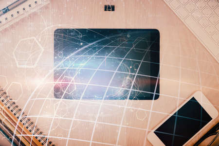 Double exposure of map hologram drawing over desktop. Top view. International connection concept.の写真素材