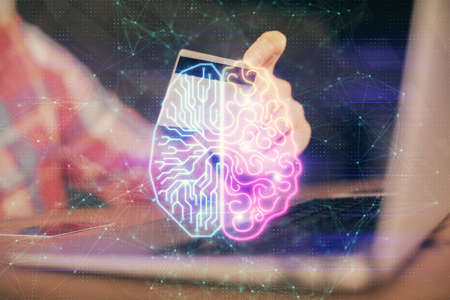 Double exposure of man hands typing on computer with credit card and brain theme drawing. E-commerce...