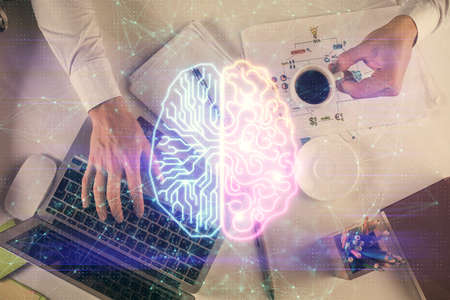 Double exposure of man's hands typing over computer keyboard and brain hologram drawing. Top view. Ai and data technology concept.の写真素材