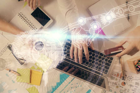 Double exposure of man's hands typing over computer keyboard and brain hologram drawing. Top view. Ai and data technology concept.の写真素材
