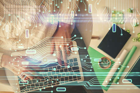 Double exposure of woman hands working on computer and data theme hologram drawing. Top View....