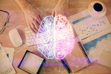 Double exposure of man's hands typing over computer keyboard and brain hologram drawing. Top view. Ai and data technology concept.の写真素材