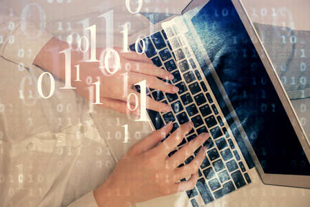 Double exposure of woman hands working on computer and data theme hologram drawing. Top View....