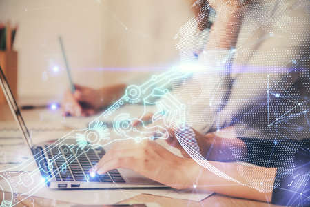 Double exposure of woman hands typing on computer and technology theme drawing. High Tech concept.の写真素材