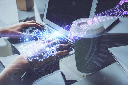 Double exposure of woman hands working on computer and data theme hologram drawing. Tech concept.