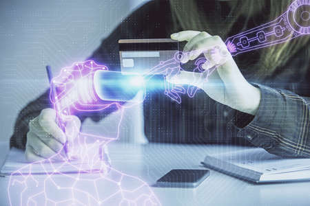 Multi exposure of woman on-line shopping holding a credit card and man in AR glasses drawing....