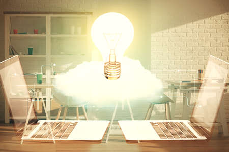 Double exposure of bulb and office interior background. Concept of idea.の写真素材
