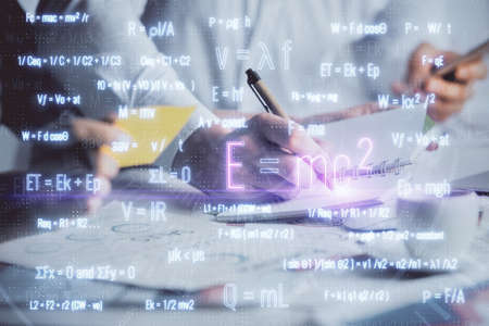 Double exposure of formula drawing over people taking notes background. Concept of educationの写真素材