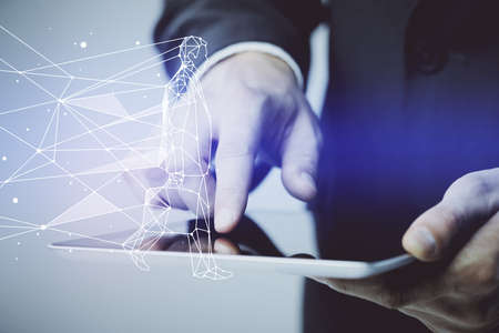 Double exposure of man's hands holding and using a mobile device and creative hologram drawing.の写真素材