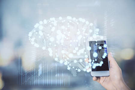 Double exposure of brain sketch hologram and woman holding and using a mobile device.