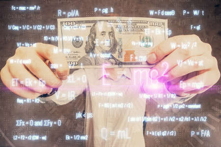 Multi exposure of Formulas drawing hologram and USA dollars bills and man hands. Education
