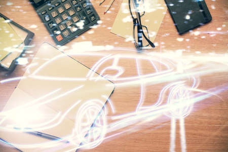 Double exposure of automobile theme drawing and work table top veiw. Concept of technology in auto industry.の写真素材