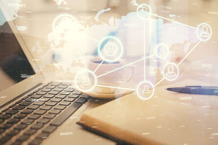 Double exposure of social network drawing and desktop with coffee and items on table background....