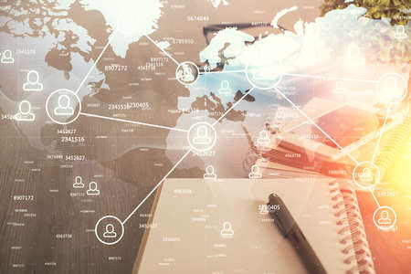 Double exposure of social network theme drawing and cell phone background. Concept of people...